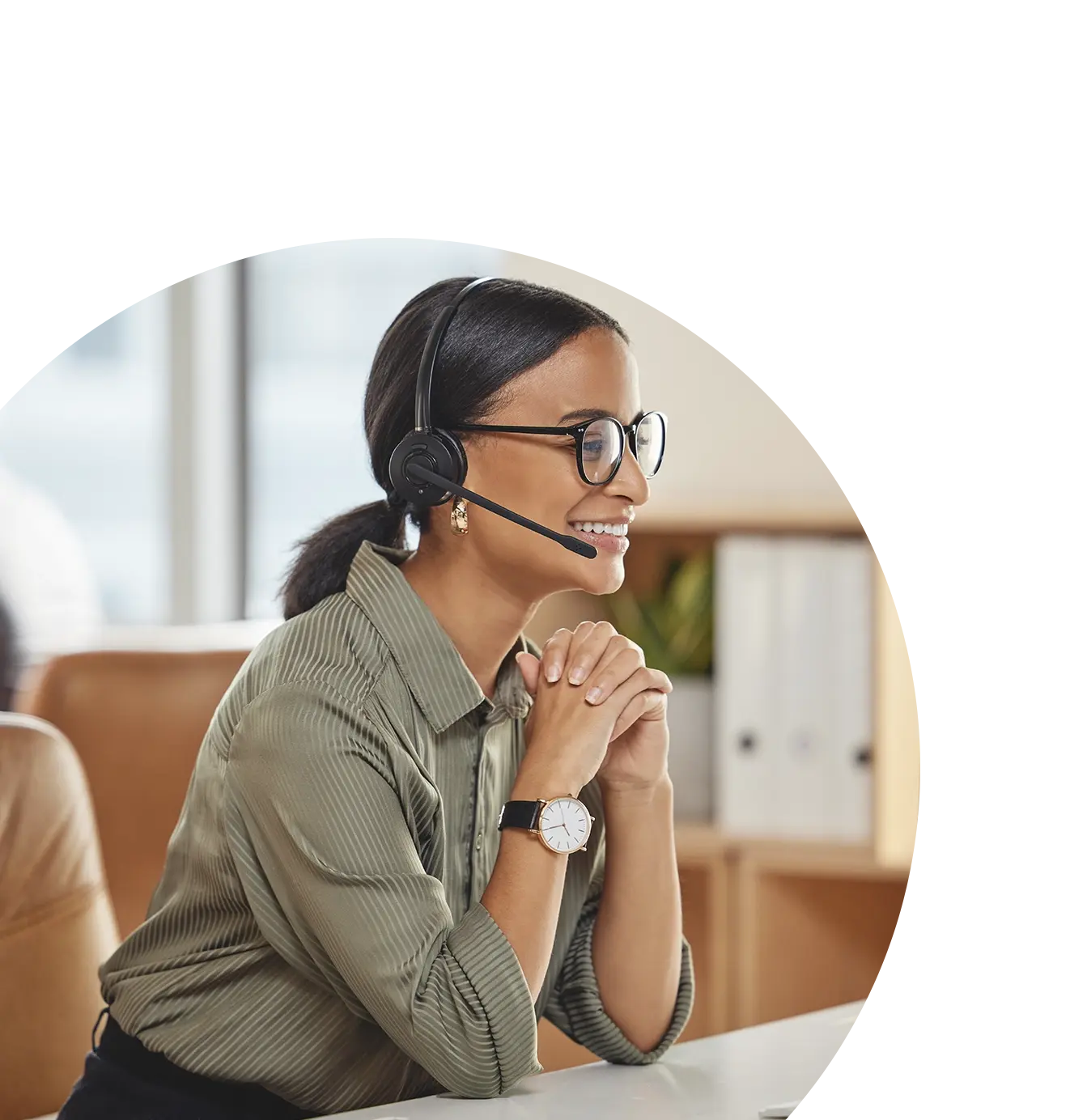 smiling call center employee wearing headset